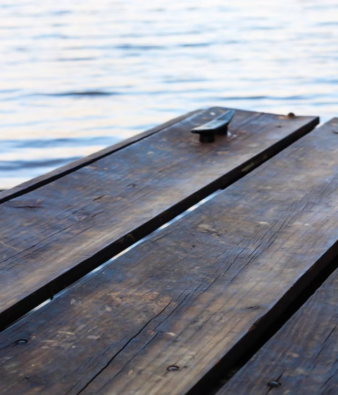 vertical-shot-wooden-boats-water